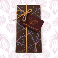 Dark chocolate bar with decorative packaging and a tag on a white background with cacao bean illustrations.