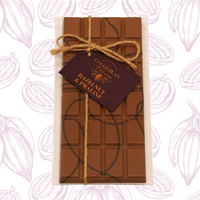 milk chocolate bar with dark chocolate swirl on decorative background