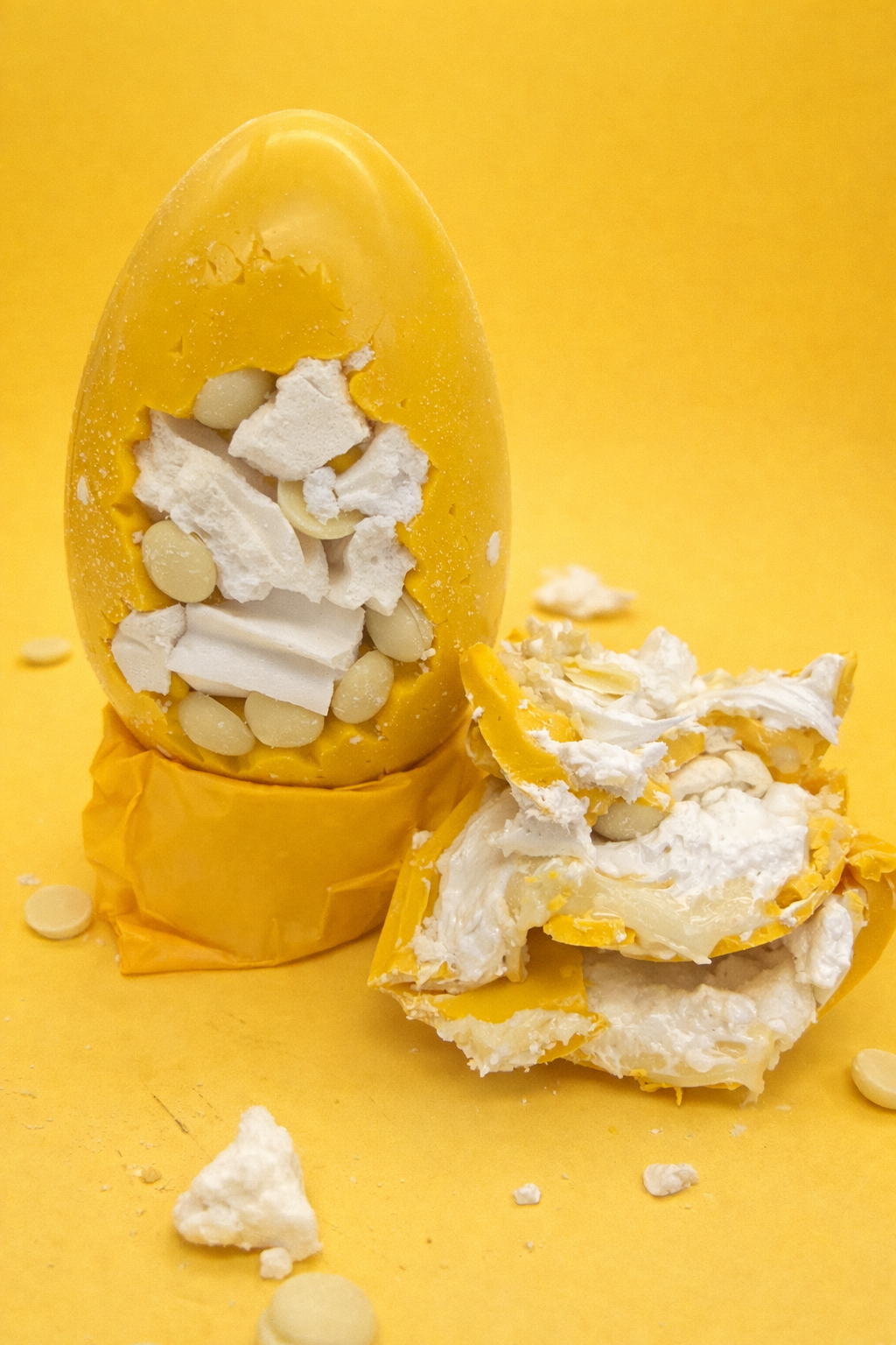 Yellow shell with white meringue centre on a yellow background