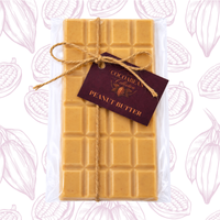 Peanut butter bar with a decorative tag on a patterned background
