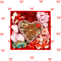 Heart-shaped candy box with 'Love You' message surrounded by heart-shaped candies on a white background with pink hearts.
