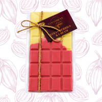 Red and yellow wax bar with 'Strawberries & Cream' flavor tag on a white background with cocoa bean pattern.