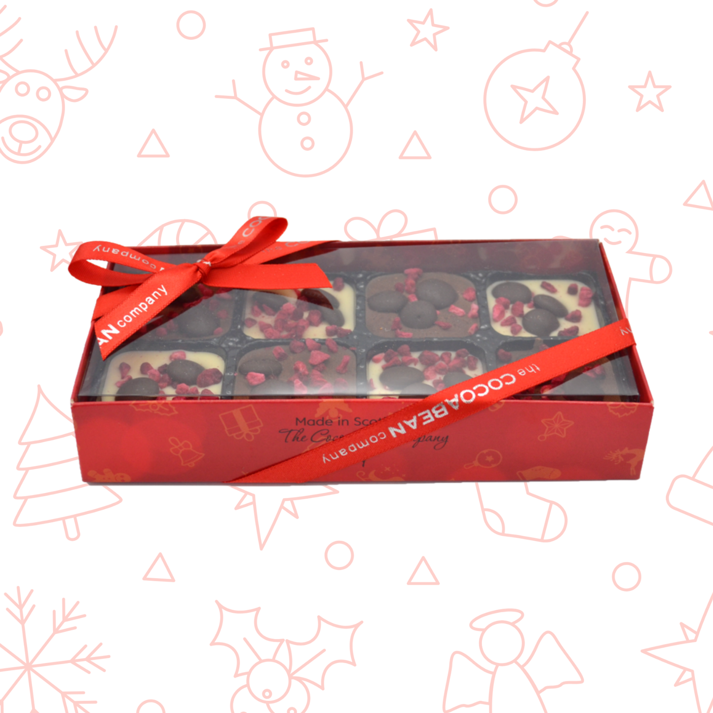 Box of chocolates with a red ribbon on a decorative background with Christmas elements.